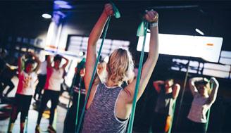 People working out with arobic resistance bands